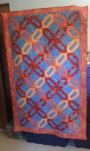 Cracker Blocks arranged in a 4 color woven pattern.