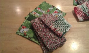 One set was 2 quilted Hot Pads, A knit dishtowel, dishcloth and scrubby