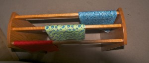 I think the blue one looks like Frank Lloyd Wright stain glass, and the green is more Tiffany style